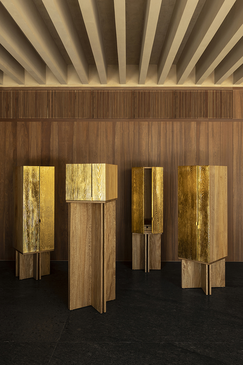 wooden AURUM cabinets clad in 23-karat gold leaf offer various configurations