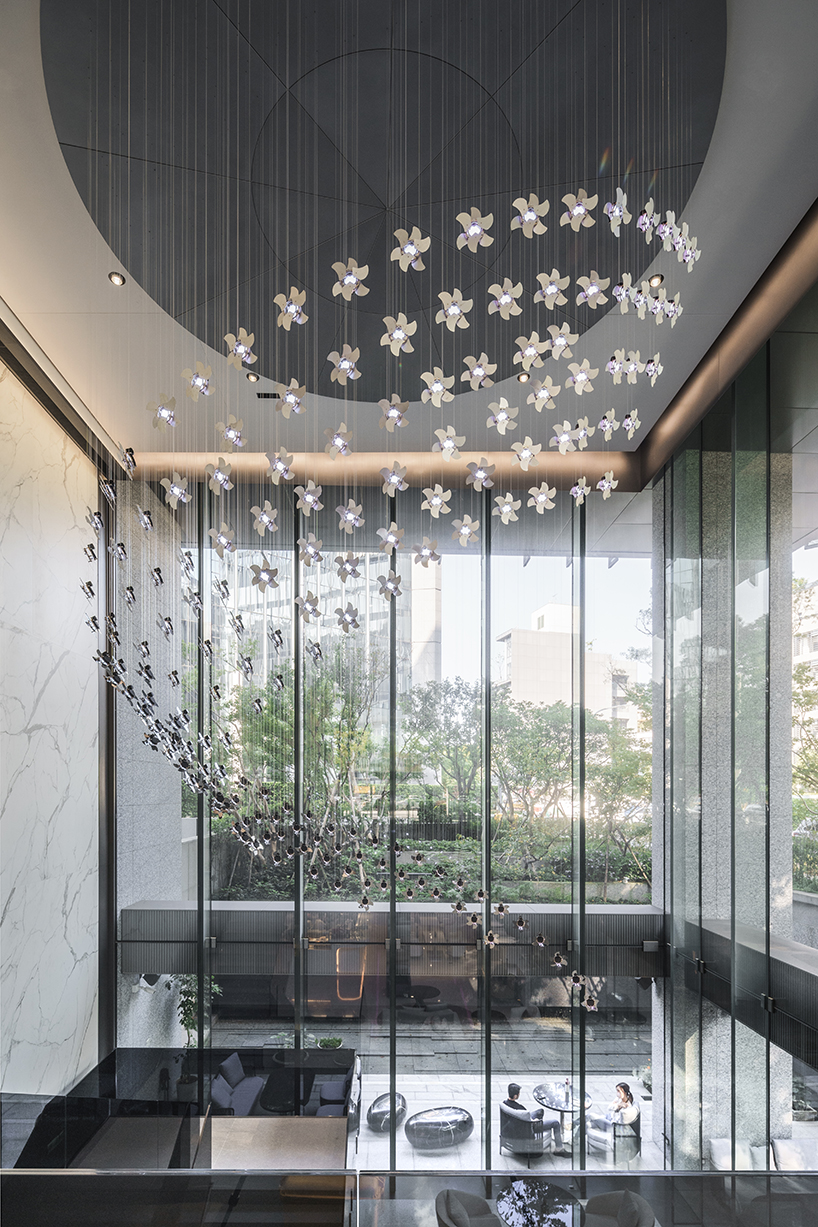 hundreds of mechanical flowers bloom in motion forming a kinetic installation in taipei