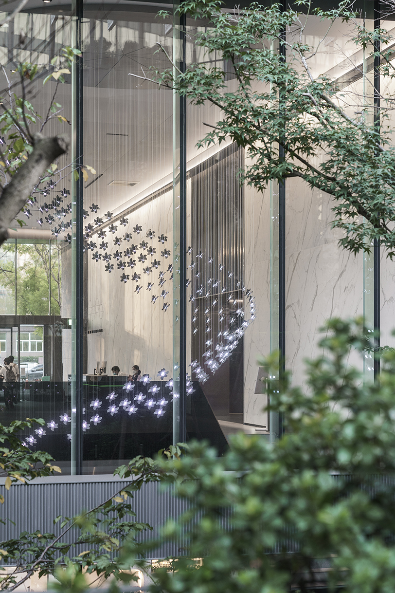 hundreds of mechanical flowers bloom in motion forming a kinetic installation in taipei
