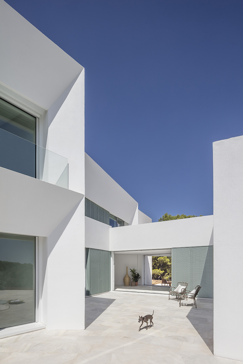 'patio house' by nomo studio offers unobstructed sea views in menorca, spain