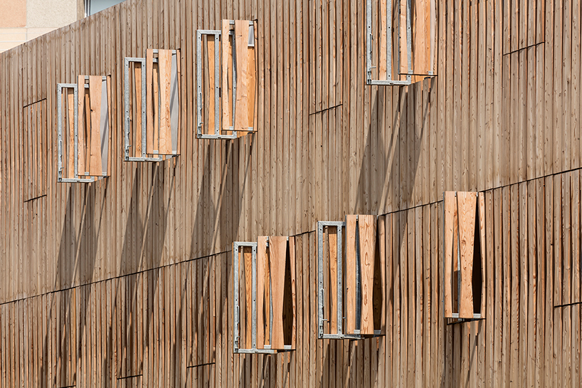 AAVP uses larchwood slats and aluminium sheets to clad student residence in paris designboom