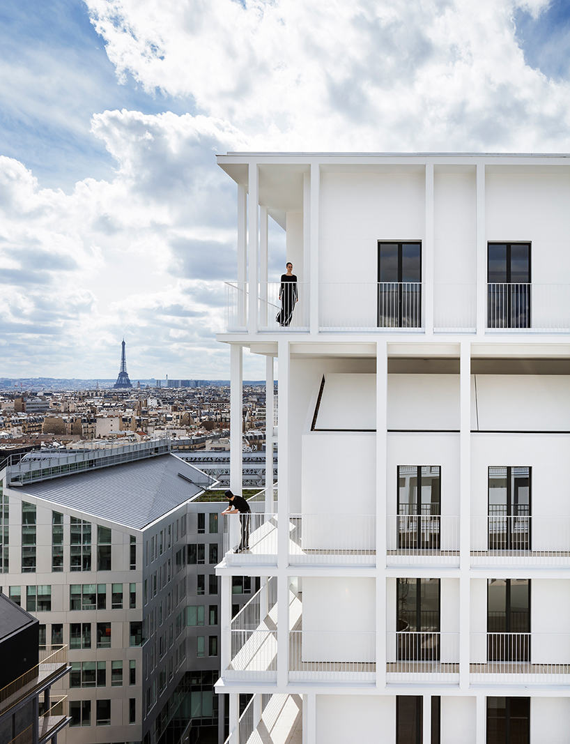 a white concrete exoskeleton frames AAVP's residential complex in paris designboom