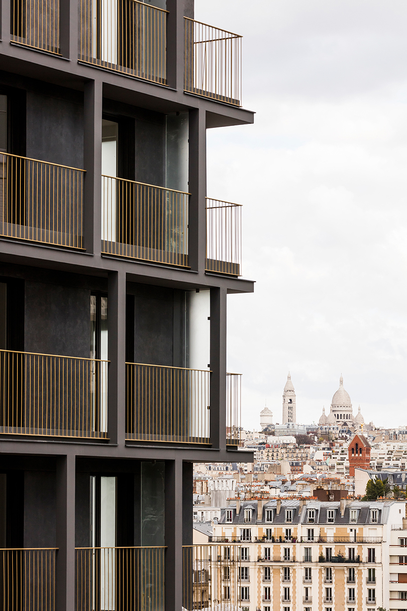 a white concrete exoskeleton frames AAVP's residential complex in paris designboom