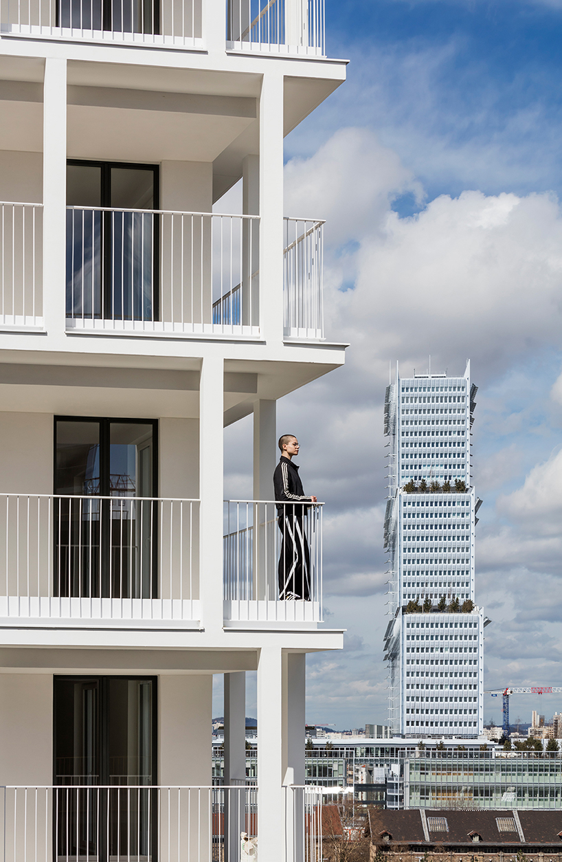 a white concrete exoskeleton frames AAVP's residential complex in paris designboom