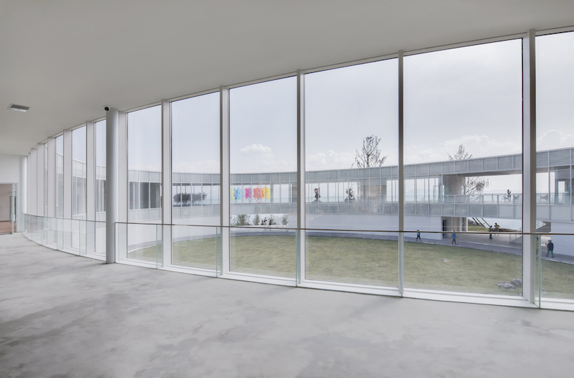C+ architects builds an elliptical ring on the mountainside for LAB art museum in china designboom