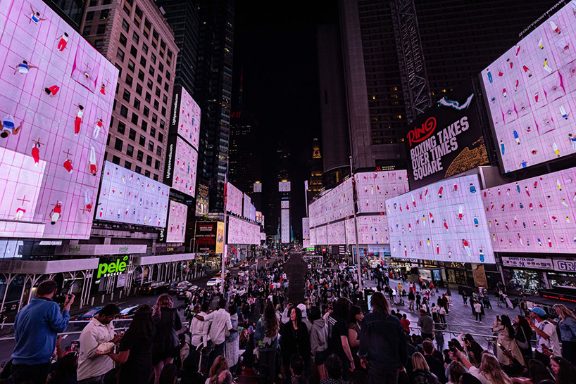 leaping olympic gymnasts form shifting colorfield in yuge zhou's NYC times square takeover