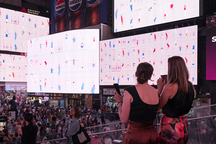 leaping olympic gymnasts form shifting colorfield in yuge zhou's NYC times square takeover