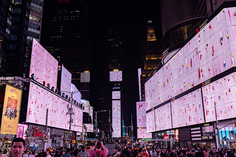 leaping olympic gymnasts form shifting colorfield in yuge zhou's NYC times square takeover