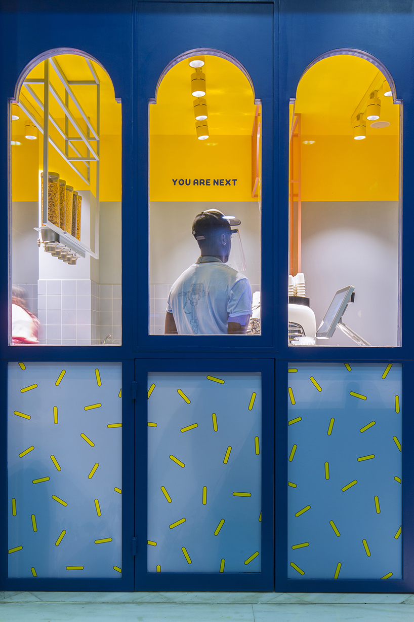 bright color contrasts + graphic lettering realize ice cream store by studiomateriality in greece