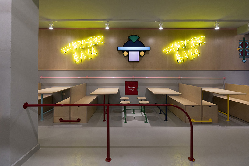 graffiti fonts and neon signs characterize studiomateriality's 'surfer maya' restaurant in greece
