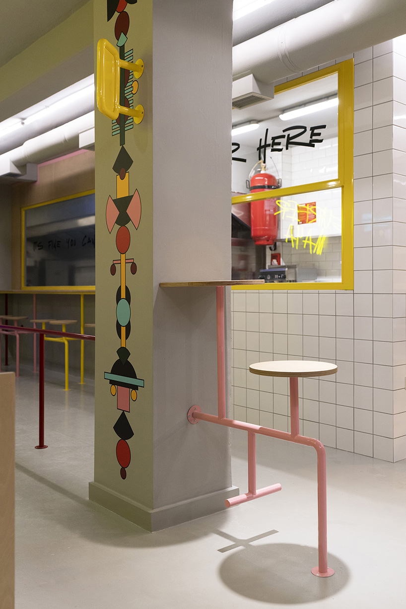 graffiti fonts and neon signs characterize studiomateriality's 'surfer maya' restaurant in greece
