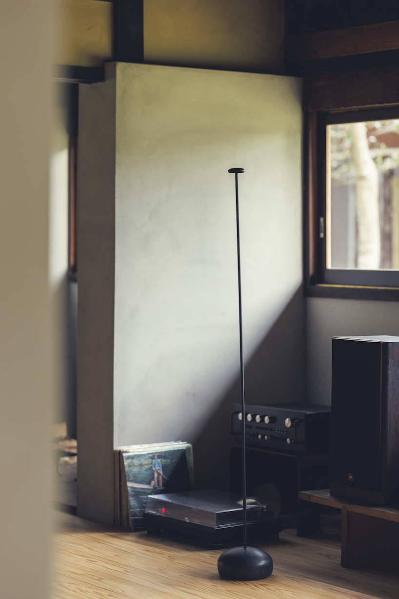 spindle coat rack by koichi futatsumata gently sways when garments are hung on it