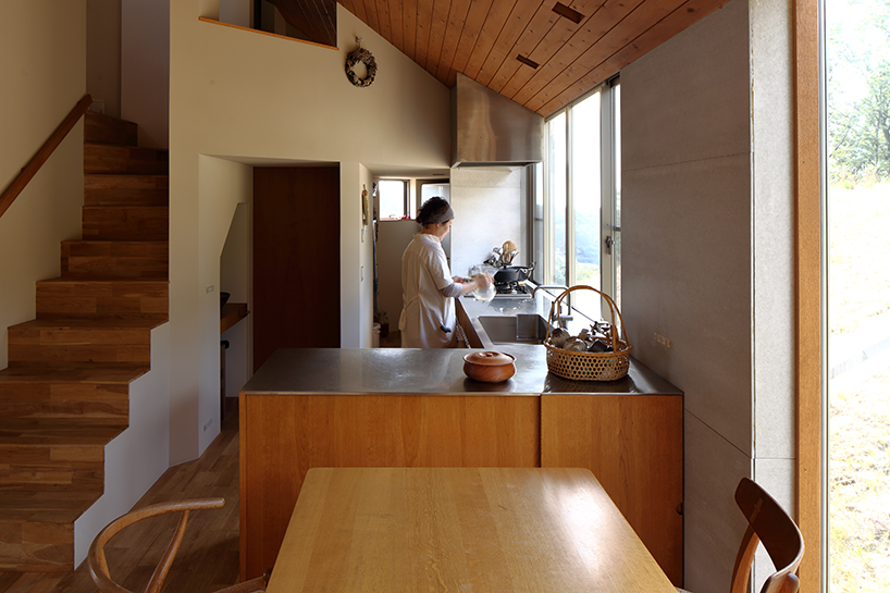fujiwaramuro architects' triangular house in kobe sits atop hilly japanese terrain - 7