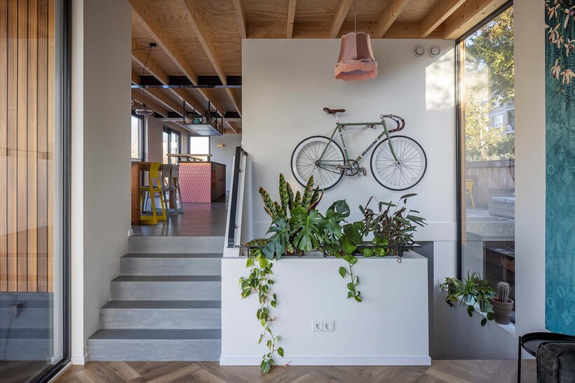 floating wooden houseboat by EVA architecten embraces canal views in utrecht