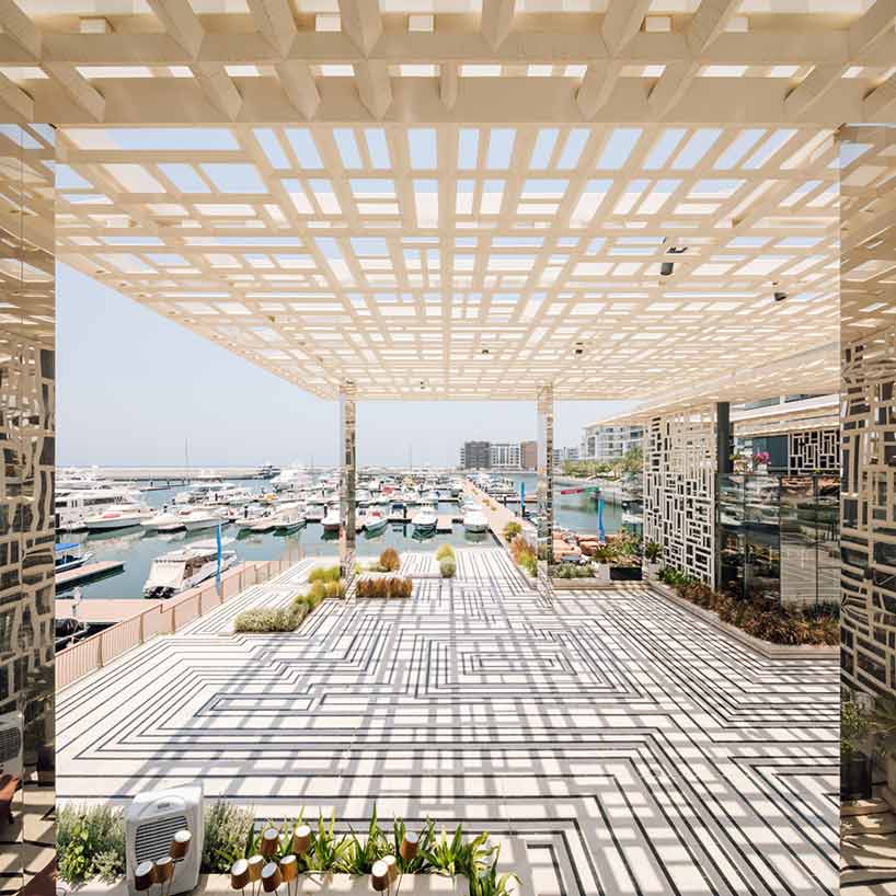 acme uses traditional geometries and local marble to build marsa plaza in muscat designboom