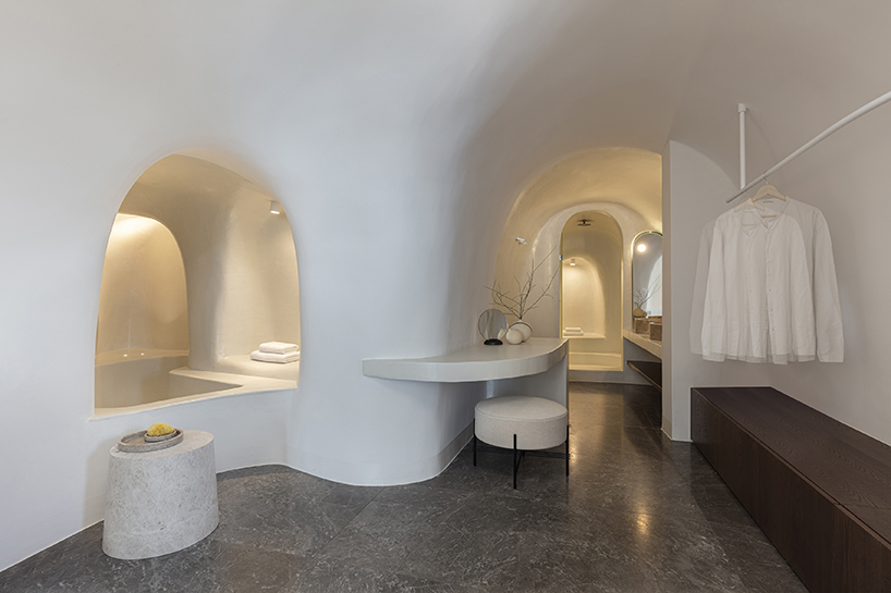 kapsimalis architects’ summer house in santorini emerges from a cliffside cave