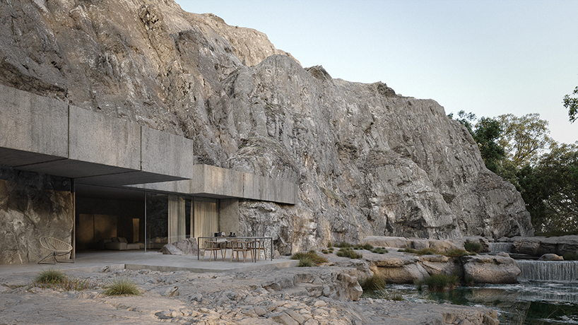 joão cepeda carves granite house into rugged cliffside in portugal