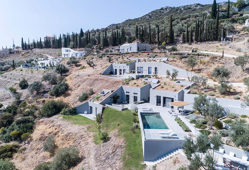 A2 architects nestles three houses into the greek coastline designboom