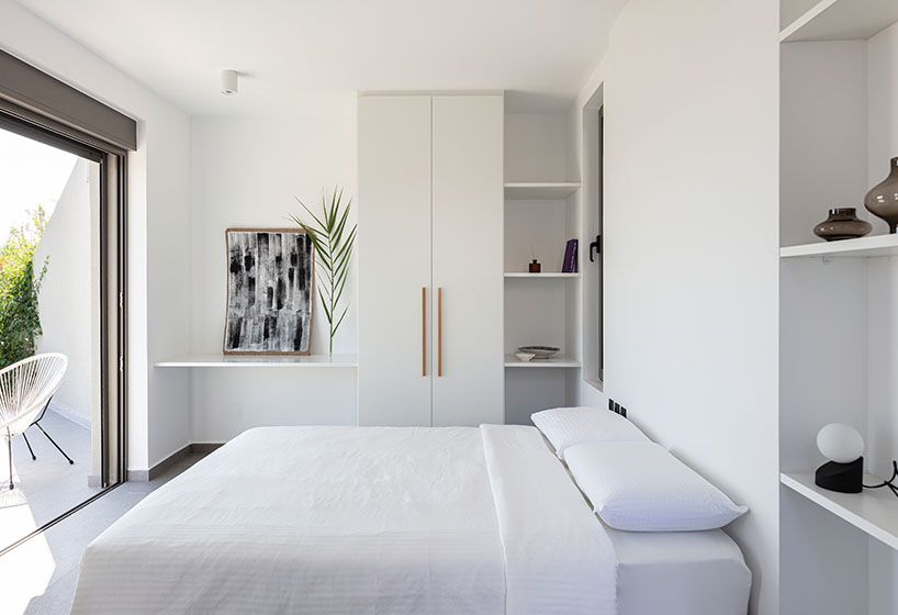 A2 architects nestles three houses into the greek coastline designboom