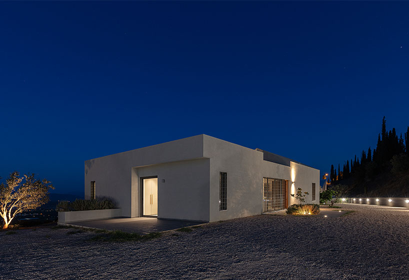 A2 architects nestles three houses into the greek coastline designboom