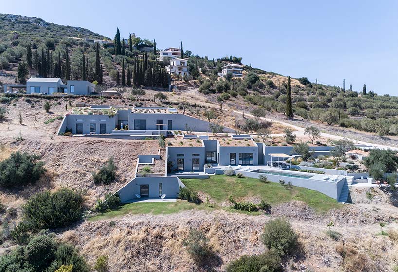 A2 architects nestles three houses into the greek coastline designboom