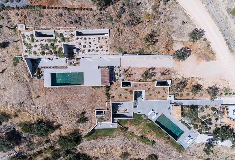 A2 architects nestles three houses into the greek coastline designboom