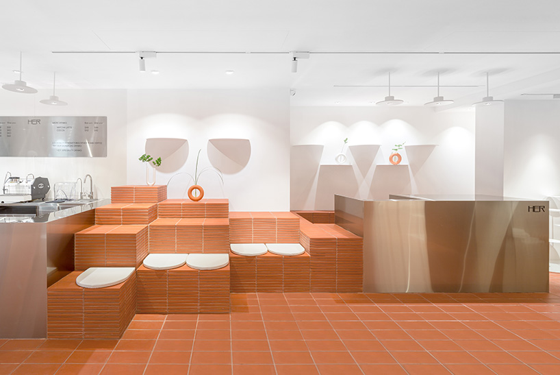 CLAP studio designs hong kong fashion cafe HER to be like landing on a 'new planet' designboom