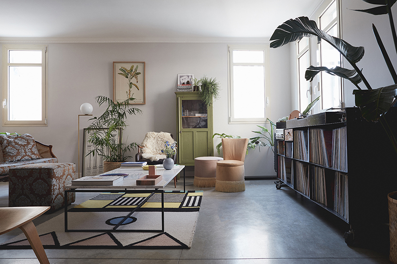 this apartment in tel aviv uses a wooden storage unit to separate private spaces - 3