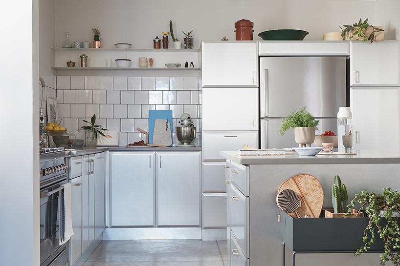 this apartment in tel aviv uses a wooden storage unit to separate private spaces - 4