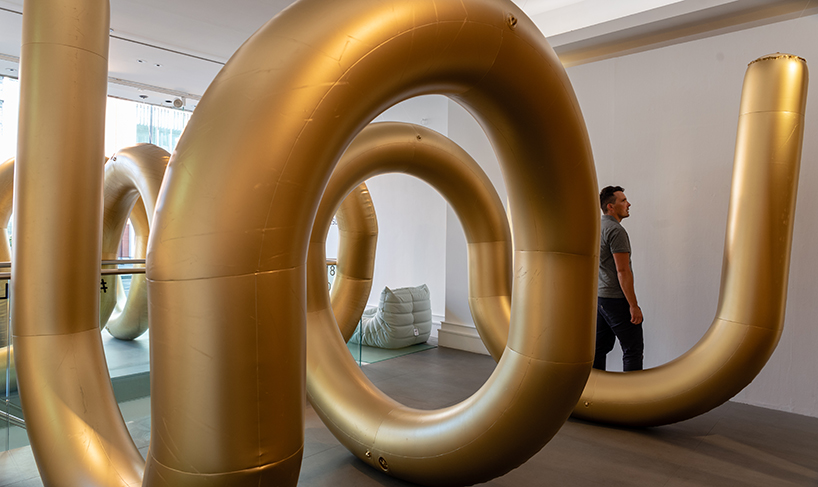 cyril lancelin fills ligne roset store with an inflatable maze of golden arches for LDF 2018 designboom