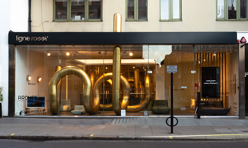 cyril lancelin fills ligne roset store with an inflatable maze of golden arches for LDF 2018 designboom