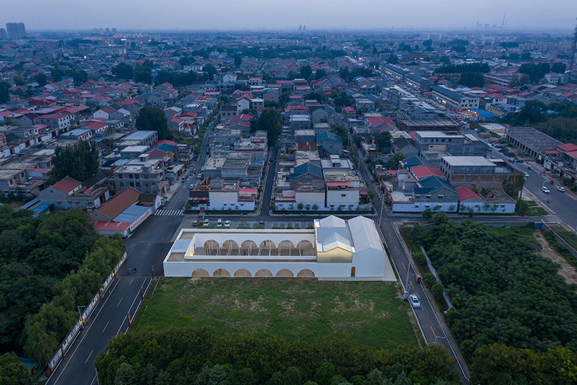 ideology humanity and nature intertwined renovation of the qinchang village cpc branch office community center an open cloister style community center 1