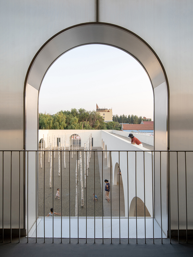 ideology humanity and nature intertwined renovation of the qinchang village cpc branch office community center an open cloister style community center 12