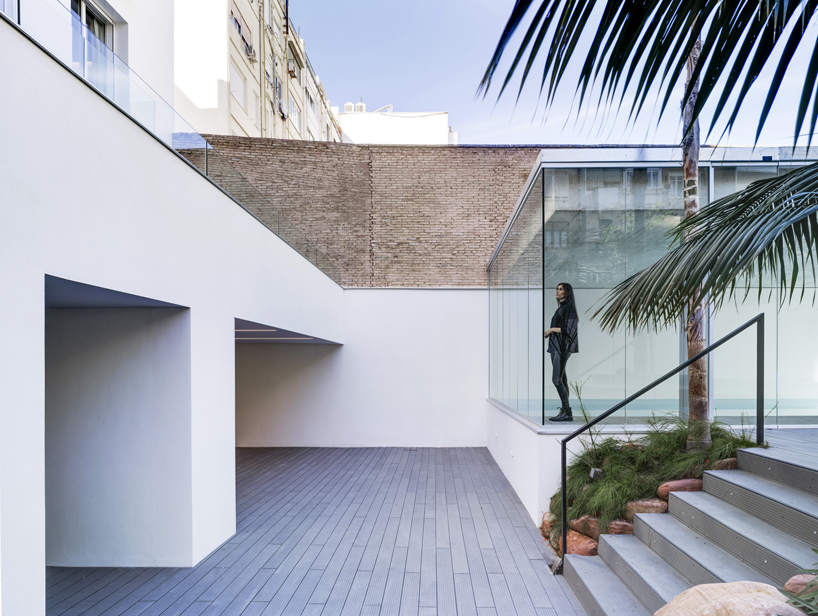 residential complex by ERRE arquitectura emerges as an urban oasis in the heart of valencia, spain