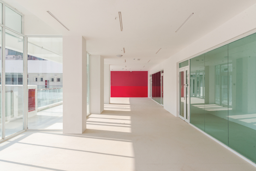 unarchitecte builds an artificial hillock into the lingbao children’s center in china designboom