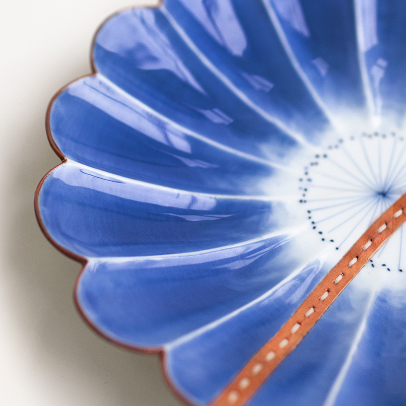 roee ben yehuda's kawatsugi salvages fragmented ceramics with leather interventions