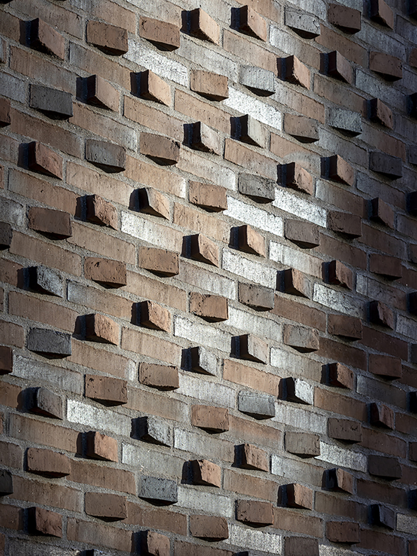 european school copenhagen clad with red bricks reflects its historical context - 9