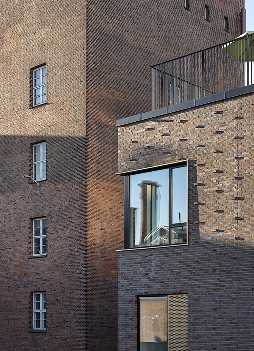 european school copenhagen clad with red bricks reflects its historical context - 10