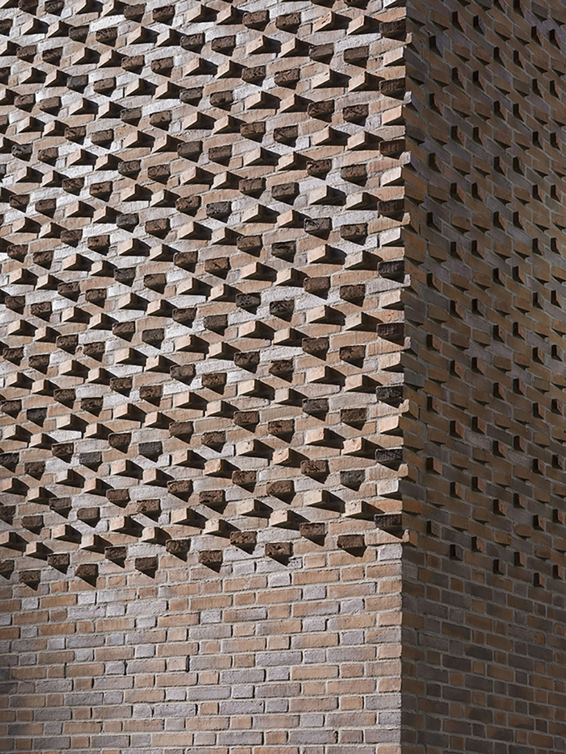 european school copenhagen clad with red bricks reflects its historical context - 11