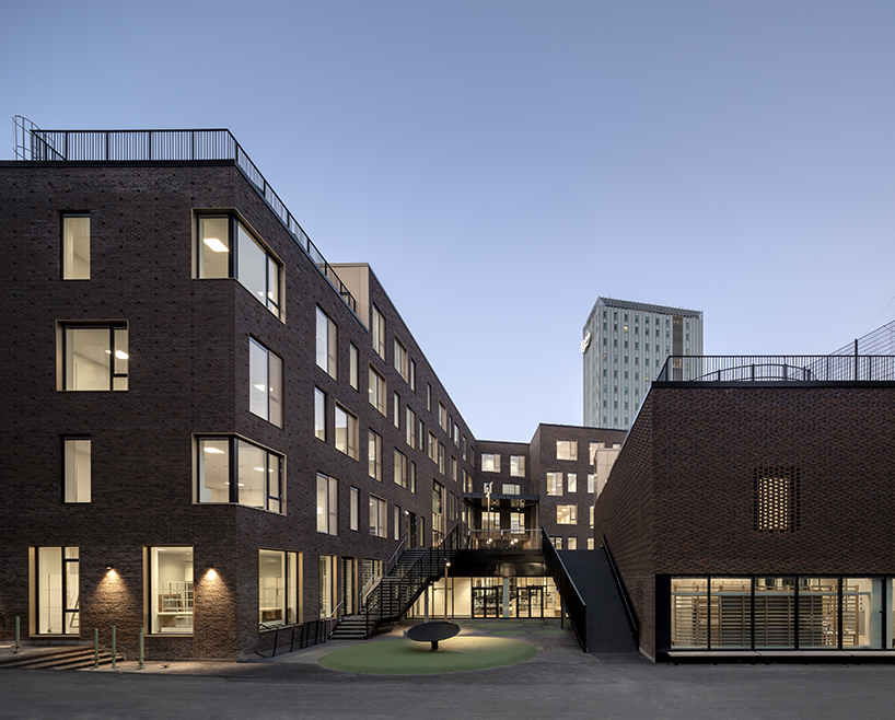 european school copenhagen clad with red bricks reflects its historical context - 2