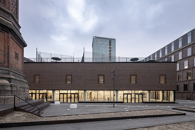 european school copenhagen clad with red bricks reflects its historical context - 3