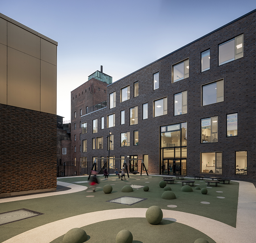 european school copenhagen clad with red bricks reflects its historical context - 7