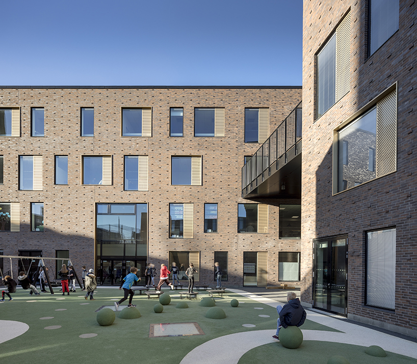 european school copenhagen clad with red bricks reflects its historical context - 8