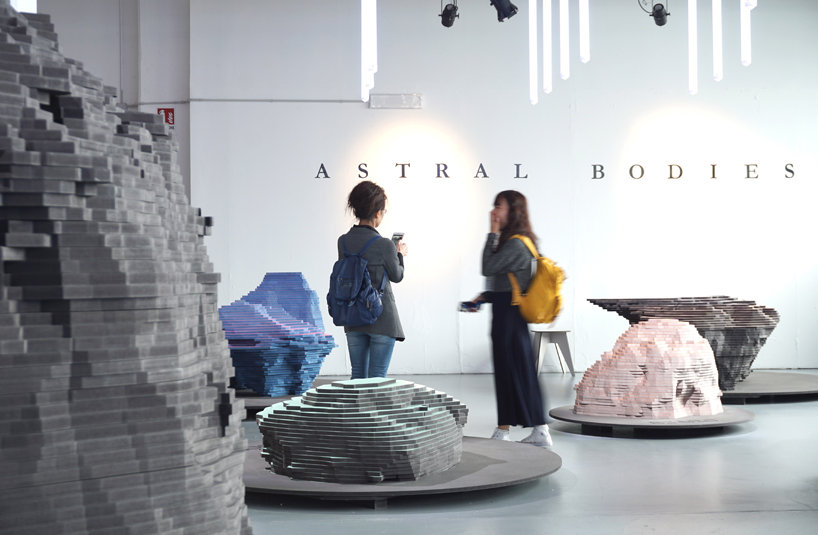 ENORME studio layers colored wood to represent 'astral bodies' that have landed on earth designboom