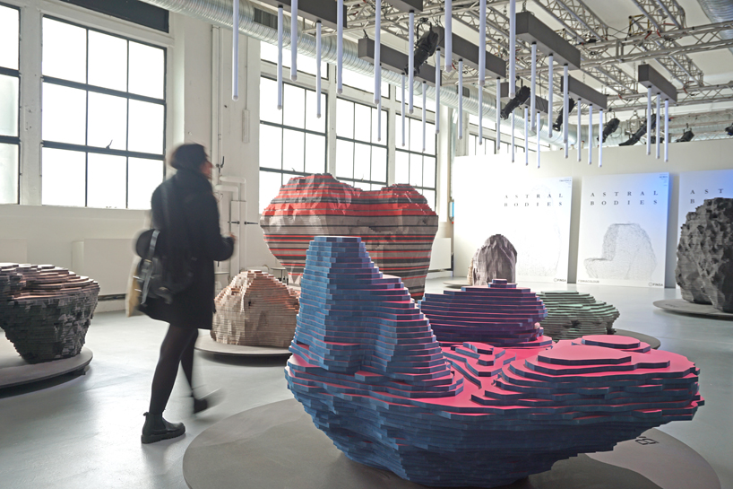ENORME studio layers colored wood to represent 'astral bodies' that have landed on earth designboom