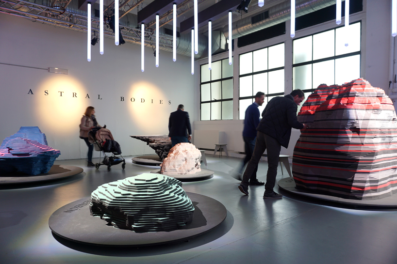 ENORME studio layers colored wood to represent 'astral bodies' that have landed on earth designboom