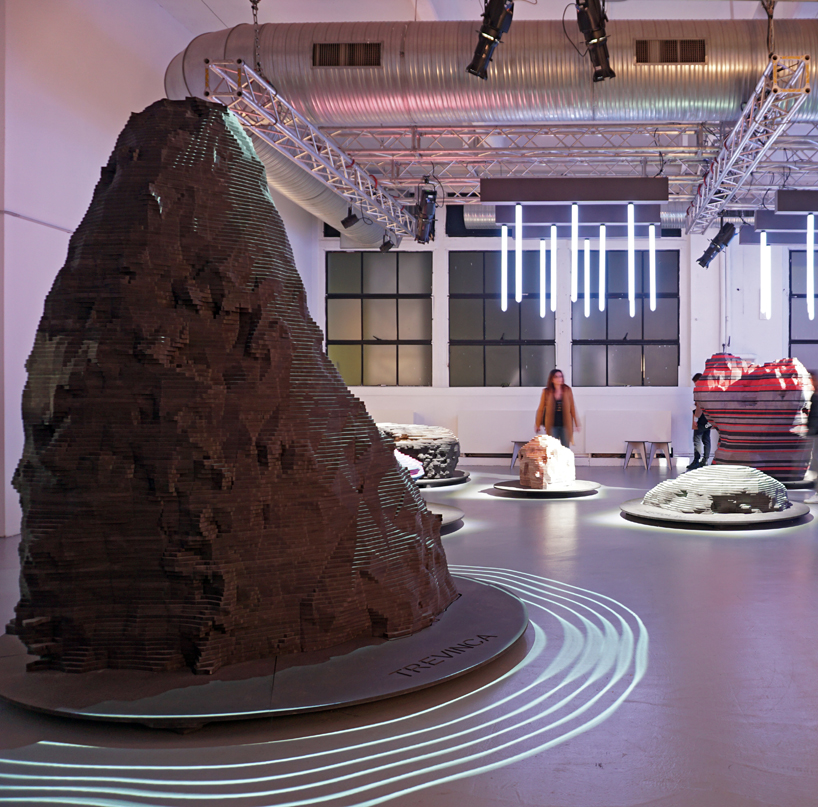 ENORME studio layers colored wood to represent 'astral bodies' that have landed on earth designboom