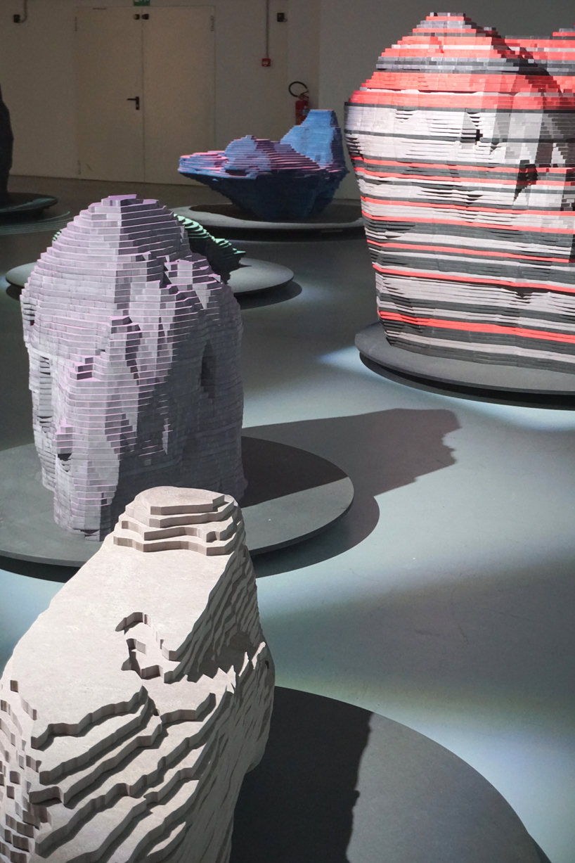 ENORME studio layers colored wood to represent 'astral bodies' that have landed on earth designboom