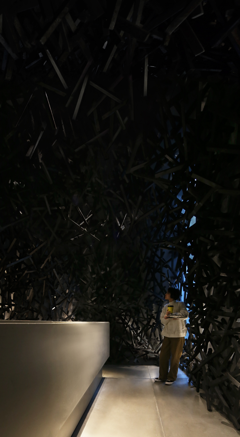 dim interior of infinity nide's café in china contrasts with bustling urban scene - 5