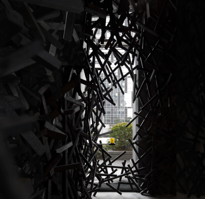 dim interior of infinity nide's café in china contrasts with bustling urban scene - 6